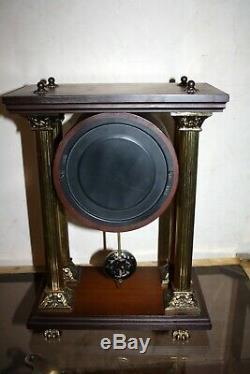 Pendule à colonne ODO, balancier, clock bronze et bois